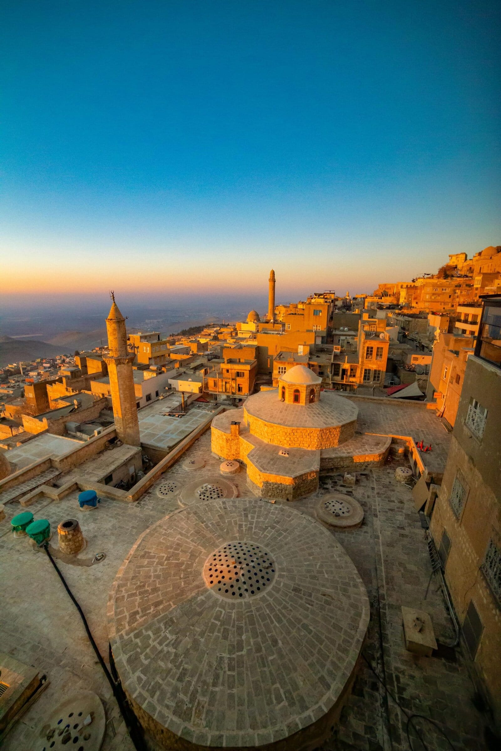 Beautiful view of Mardin, Turkey's historic cityscape at sunrise.